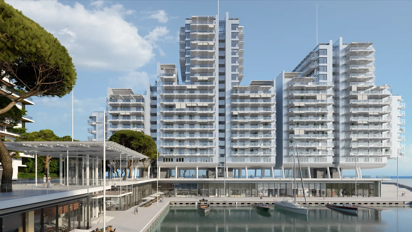 A photo of Le Renzo apartment building in Monaco. Is its apart of the Mareterra Eco-District in Monaco. In the photo you see the residence, Mareterra Port, Ocean, Trees, and surrounding shops and restaurants.