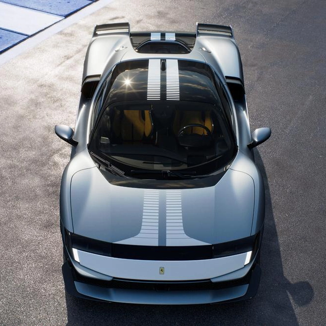A photo of a silver blue Ferrari 849 Testarossa car. This is a Birdseye view of the car on a track.