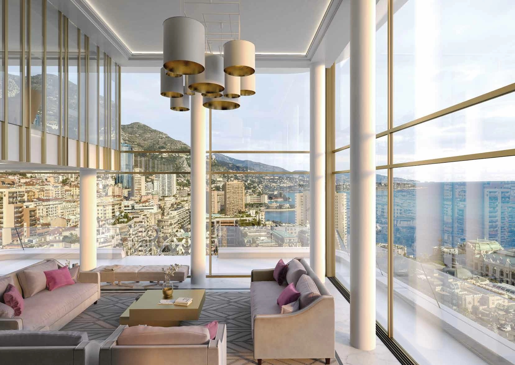 The interior of a penthouse in the 26 Carré d'Or residence. The double height living room overlooks Monte Carlo, the ocean, and Casino de Monte Carlo