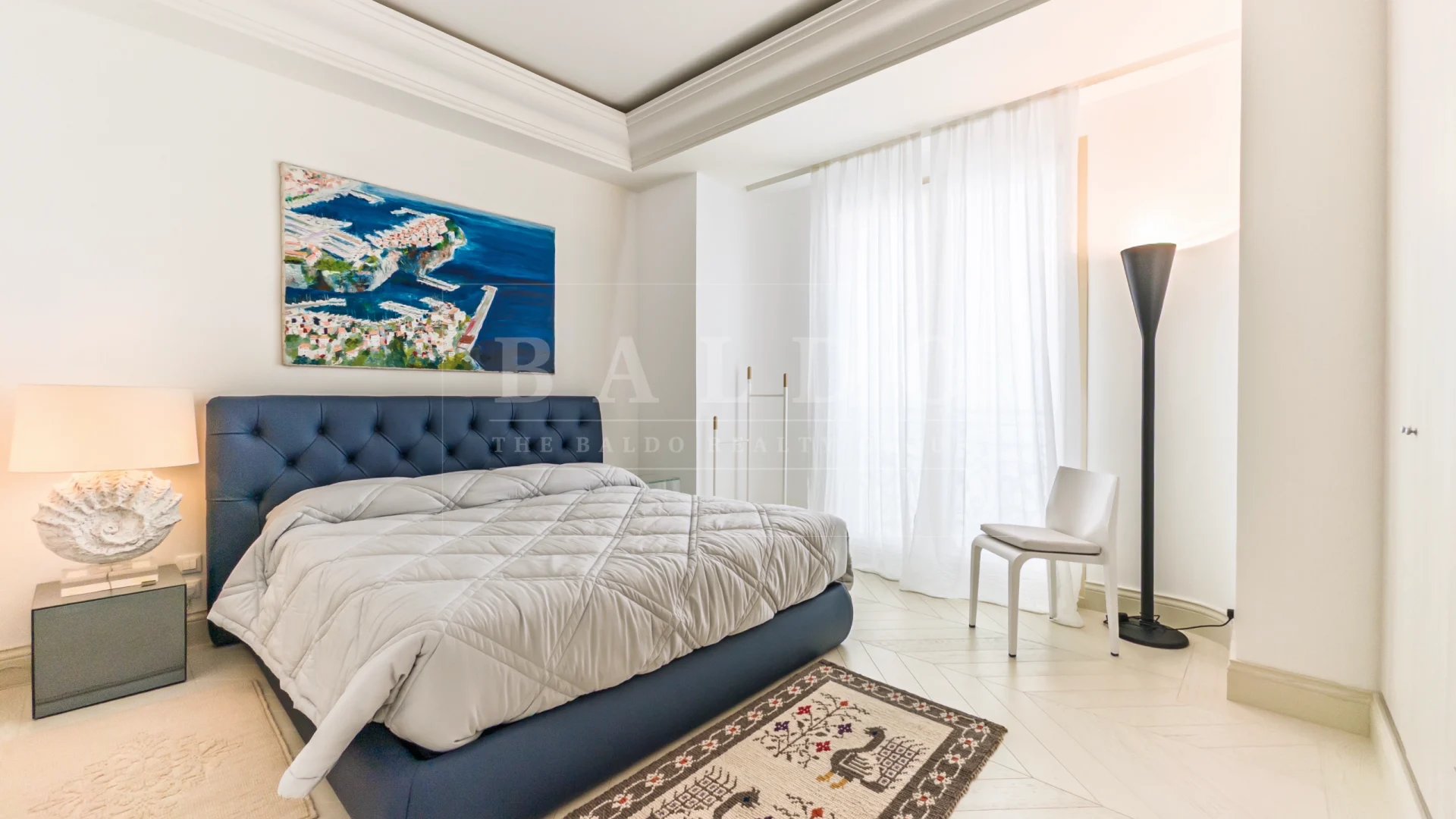 The master bedroom of an apartment in the Villa Portofino residence in Monaco.