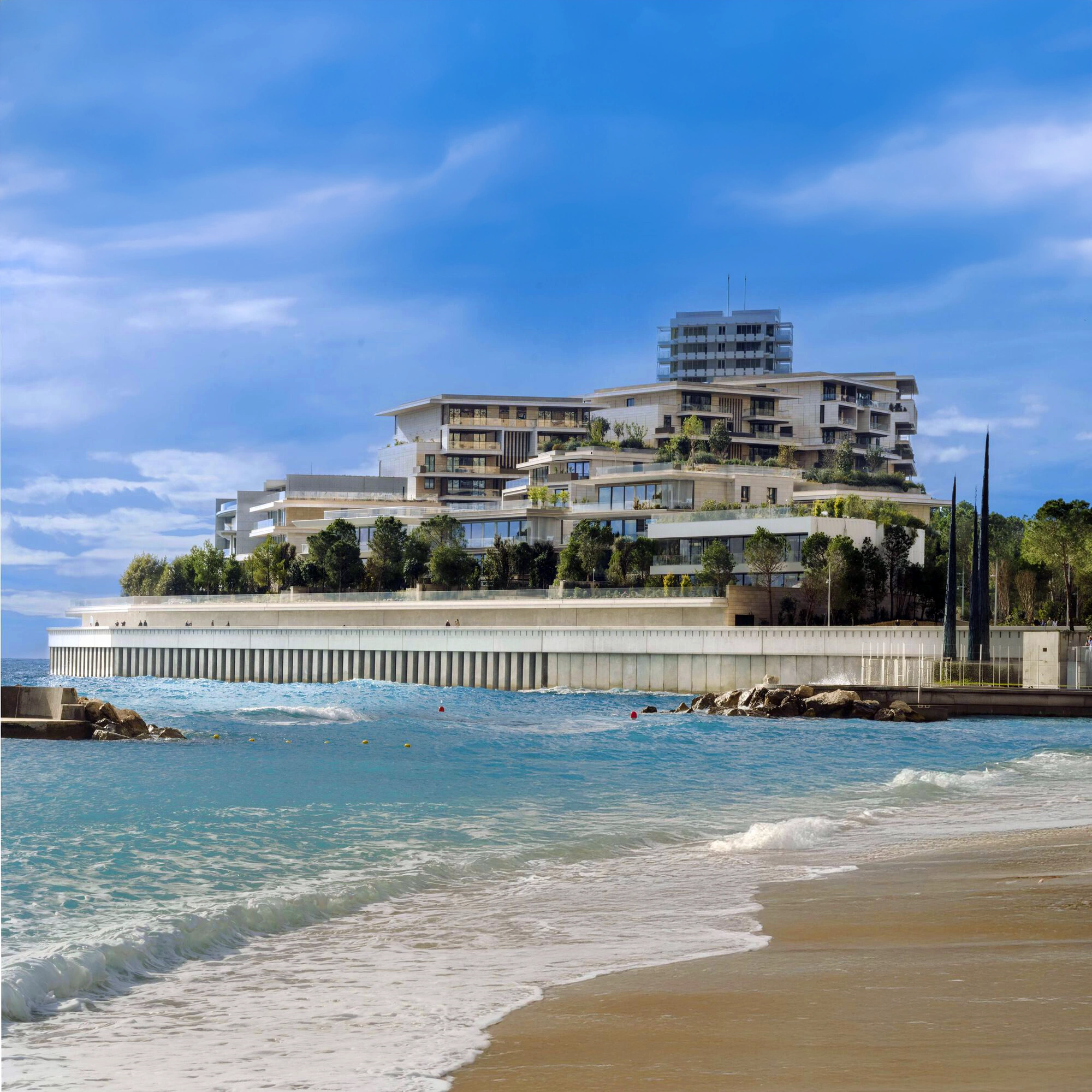 The front of Mareterra from Larvotto Beach Monaco. In this photo you see a the beach, and in the distance Les Villas in Mareterra.